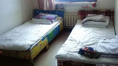 火车站外吆喝的50元一晚的宾馆能睡吗？原因是什么？